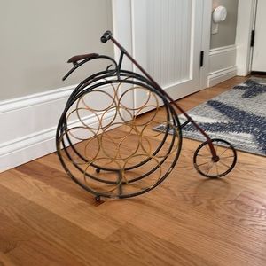 Bicycle metal framed wine rack, holds 7 bottles.